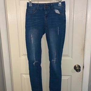 Caution to the wind skinny ripped jeans